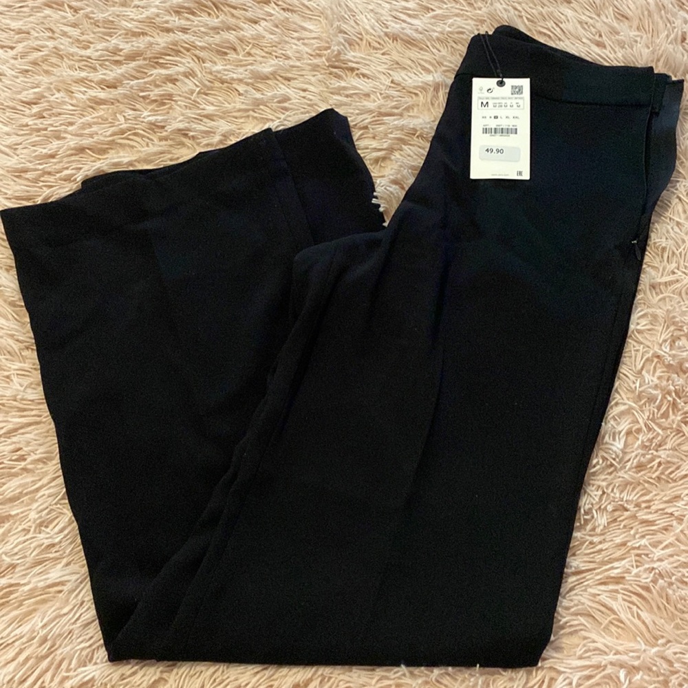 Dress pants in black by Zara